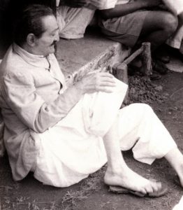 Rare_1950s_Baba_sitting_on_ground_MEHERBABATRAVELS